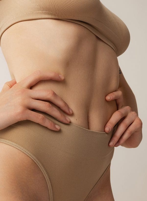 The importance of doing liposuction of the lower back and flanks during a  tummy tuck